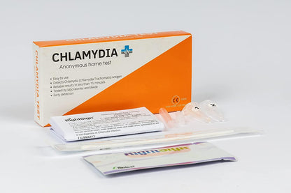 Chlamydia at-home rapid test kit with test cards and white sample tube contents